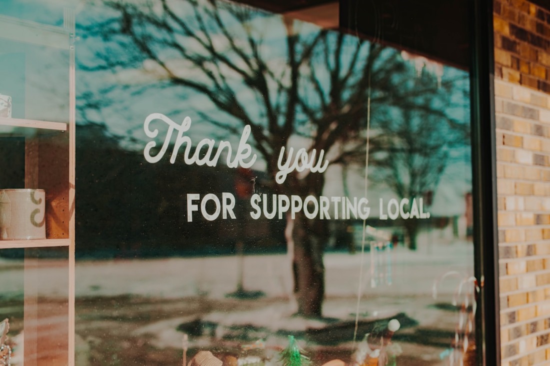 'Thank you for supporting local' shop window